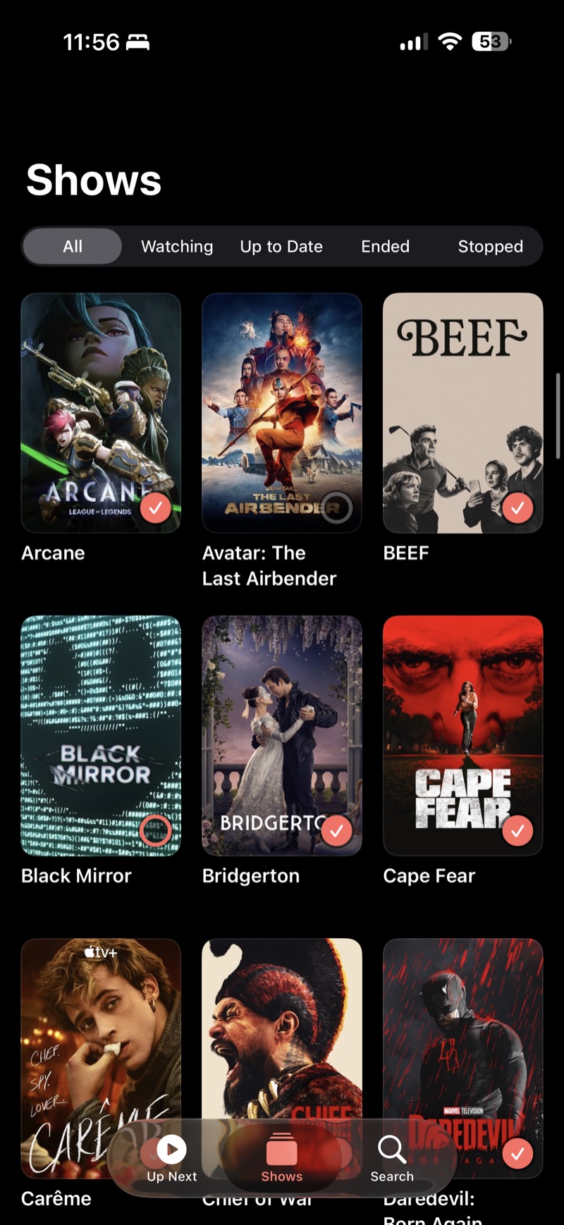 Up Next app: the Shows library as a poster grid with watched checkmarks